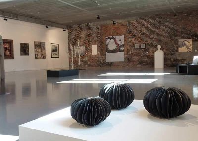 Three Black Ceramic Pieces Shaped With Seaweed